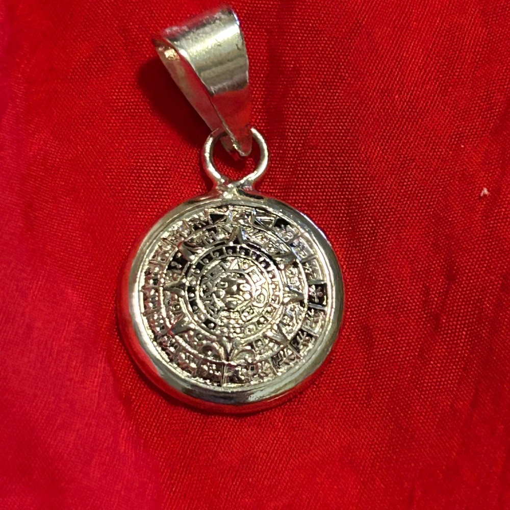 Silver Pendant with Intricate Design